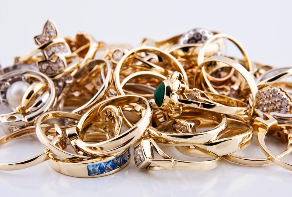 Pile of yellow gold rings and jewelry ready to sell.